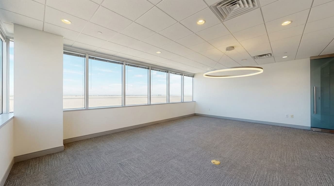 Commercial virtual staging before-and-after of empty office transformed into modern conference room with table, chairs, plants, and presentation screen.