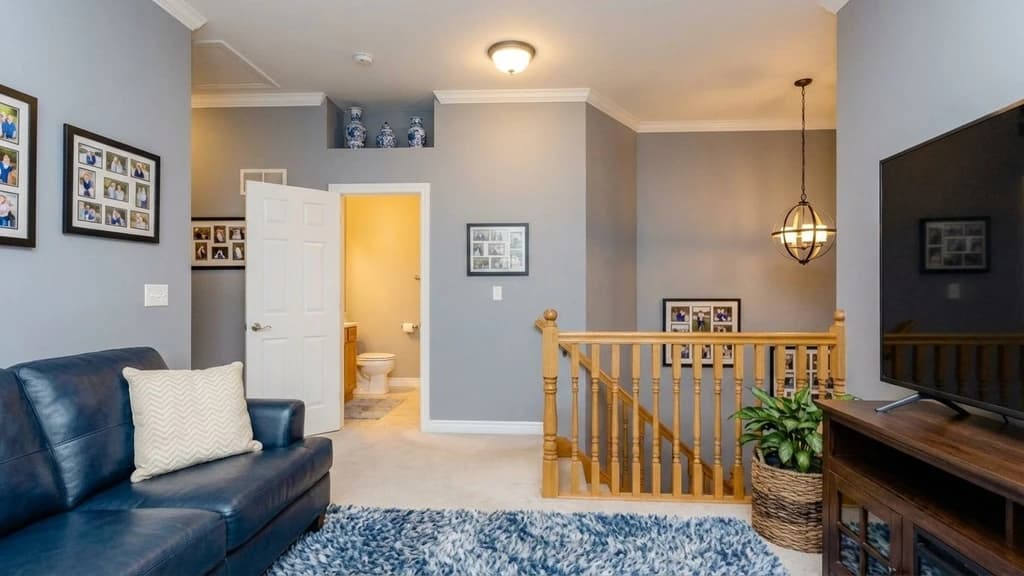 Before-and-after comparison of a living room photo upscaled with Styldod's AI image resolution tool for sharper, high-resolution clarity.