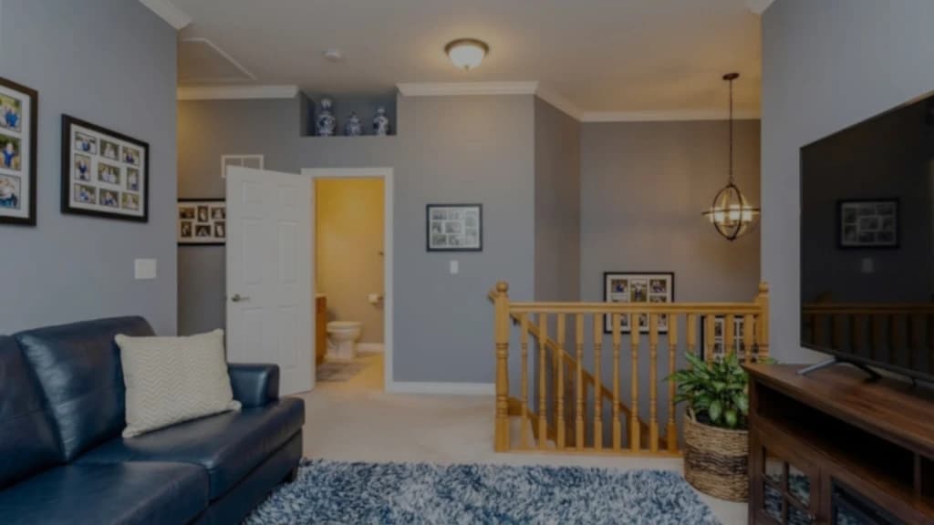 Before-and-after comparison of a living room photo upscaled with Styldod's AI image resolution tool for sharper, high-resolution clarity.