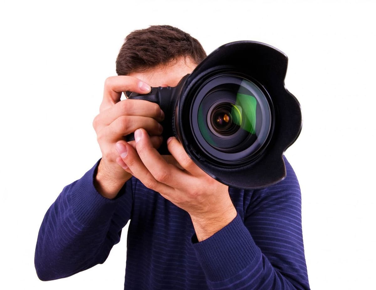 Real estate photographer with camera